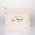 An off-white canvas cosmetic pouch with a gold zipper pull and a black printed 'UpCircle' logo, set against a clean white background.