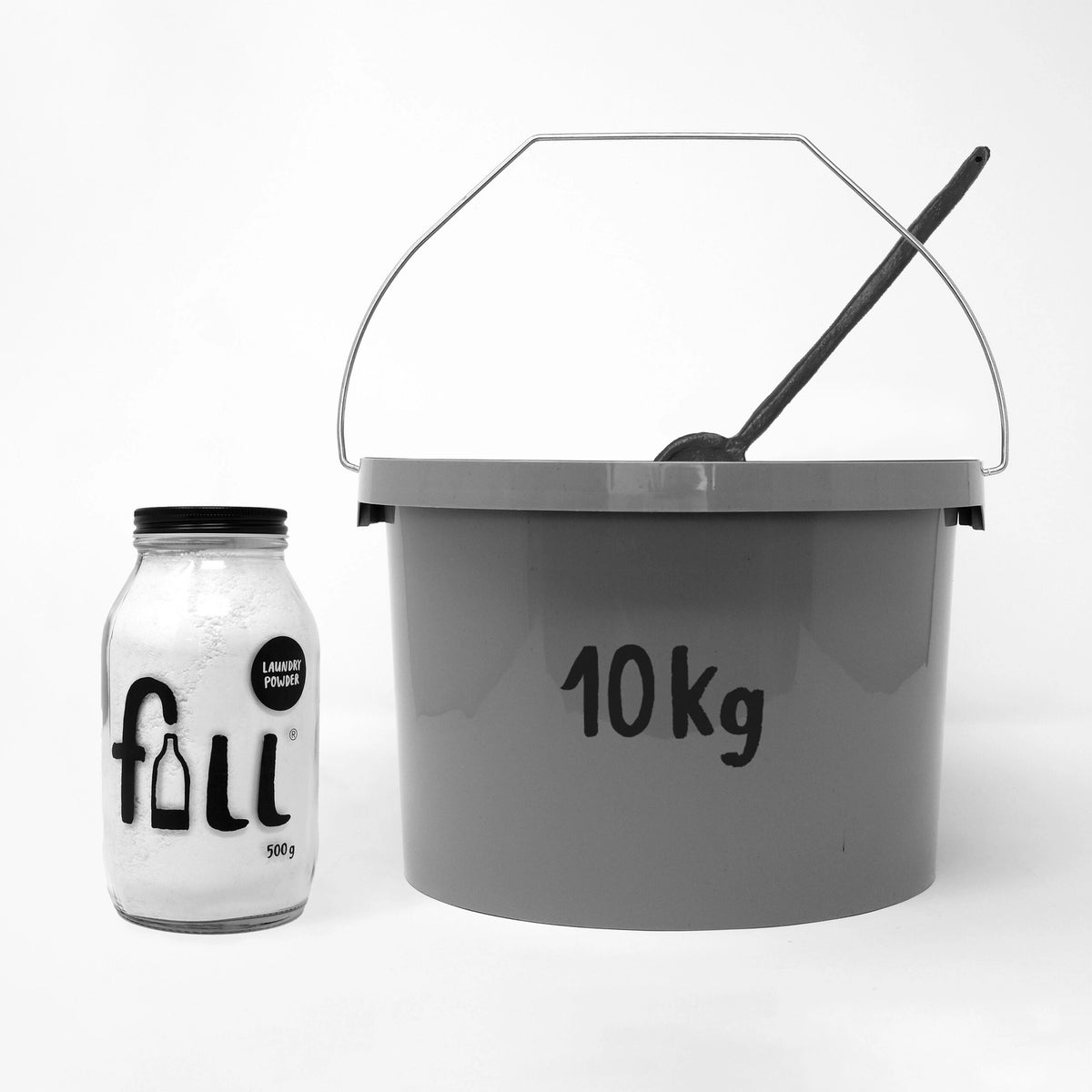 A gray 10 kg bucket with a wire handle and black scoop, shown next to a clear glass jar labeled 'full' on a white background.