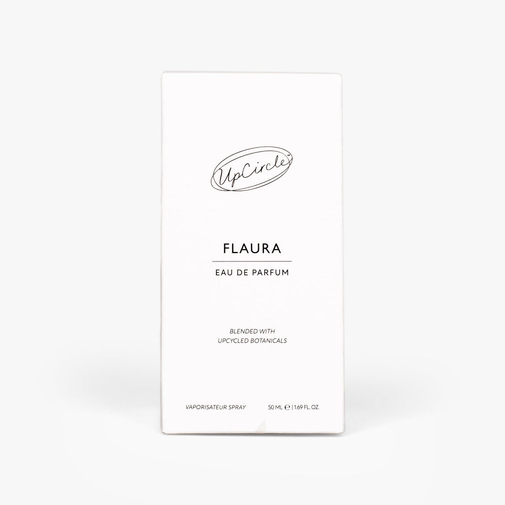A tall, slim white rectangular box for UpCircle Flaura Eau de Parfum.