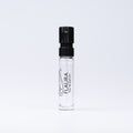 A clear glass perfume sample spray bottle with a black atomizer cap, labeled 'FLAURA Eau de parfum', set against a plain white background.