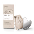 UpCircle Gua Sha tool with packaging and drawstring bag on a white background