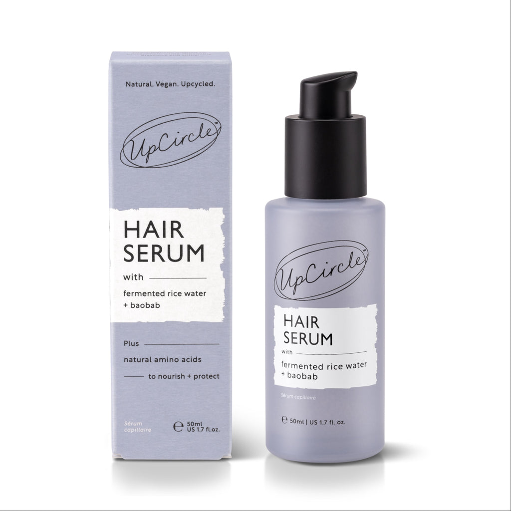 UpCircle hair serum bottle and packaging on a white background