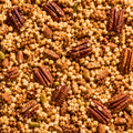 A close up shot of Ashura Cereal, puffed quinoa, pecans and other cereal filling the entire frame.c