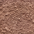 A close-up shot of organic cacao powder filling the entire frame. 