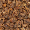 A macro close up image of organic chopped dates filling the entire frame. 