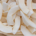A close-up shot shows toasted coconut chips filling the entire frame. 