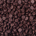 A close up of Dark Chocolate Coated Drops filling the entire frame. 