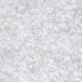 A full frame close-up shows a mass of small, white, crystalline structures. 