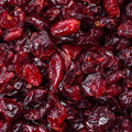 This eye-level close-up features a mass of dried cranberries.