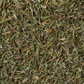 A close-up texture shot organic thyme leaves filling the entire frame.
