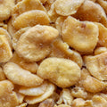 A high-angle close-up captures a pile of roasted fava beans, creating a visually appealing texture of healthy snacks. 