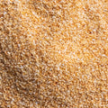 A textured close up shot of garlic granules filling the entire frame. 