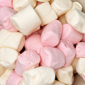 Close-Up of Pink + White marshmallows, filling the entire frame. 