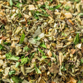 A close-up shot of mixed dried herbs filling the entire frame. 