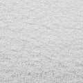 A textured full frame composition shows a dense collection of small white spheres filling the space.