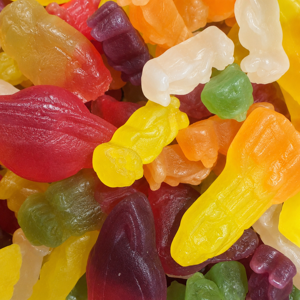 Close-up image of gummy sweets of various shapes/sizes filling the frame.