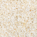 A close-up texture shot psyllium husk, filling the entire frame. 