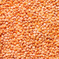 A tight frame shows an overhead view of a pile of Red Split lentils