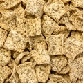 A Close-up image of textured seaweed crisps filling the entire frame.