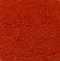A close-up image captures a vibrant expanse of smoked paprika.