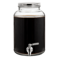 A large ribbed clear glass beverage dispenser filled with dark coffee, featuring a silver metal lid and a silver metal spout with a gray handle, isolated on a white background.