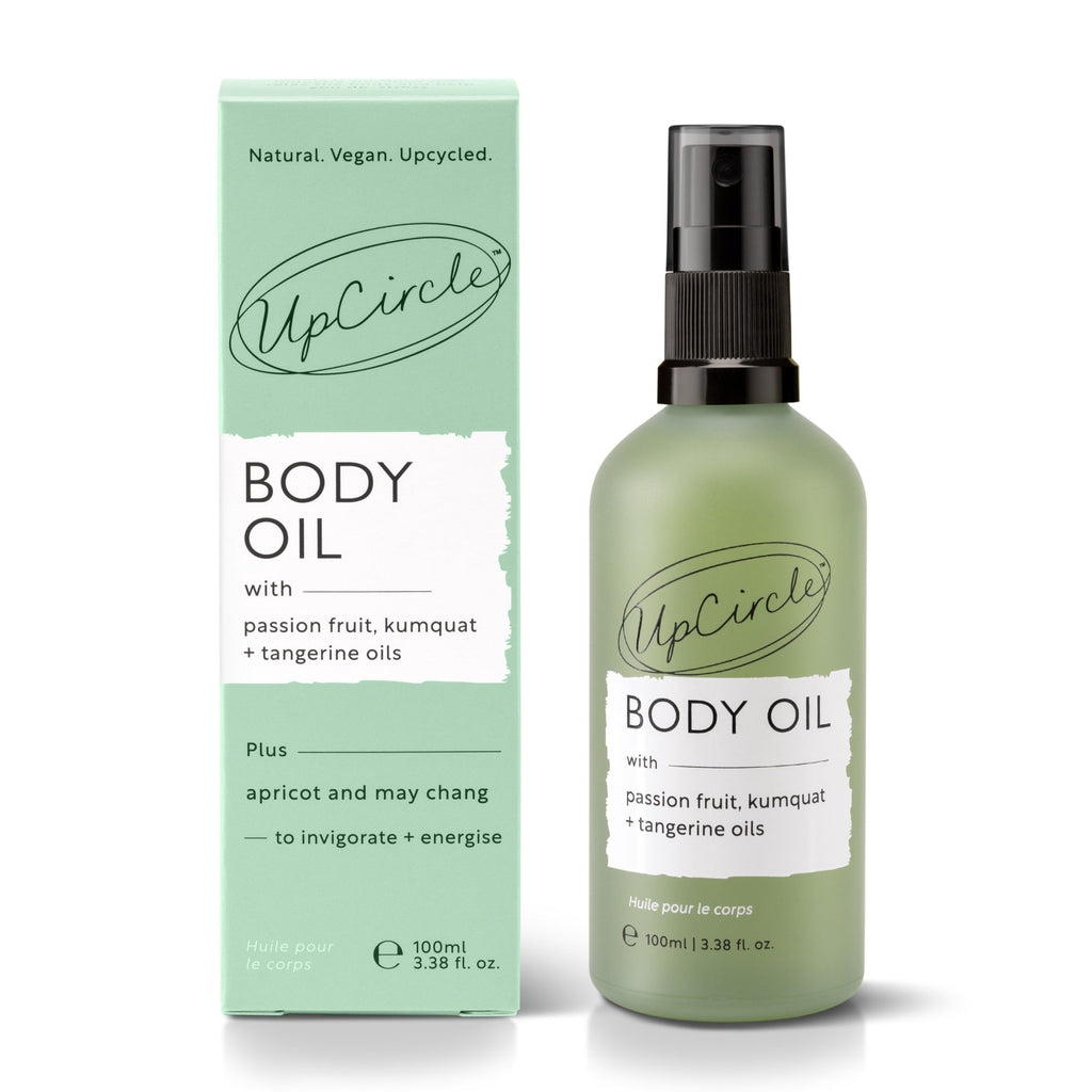 UpCircle body oil bottle and packaging on a white background