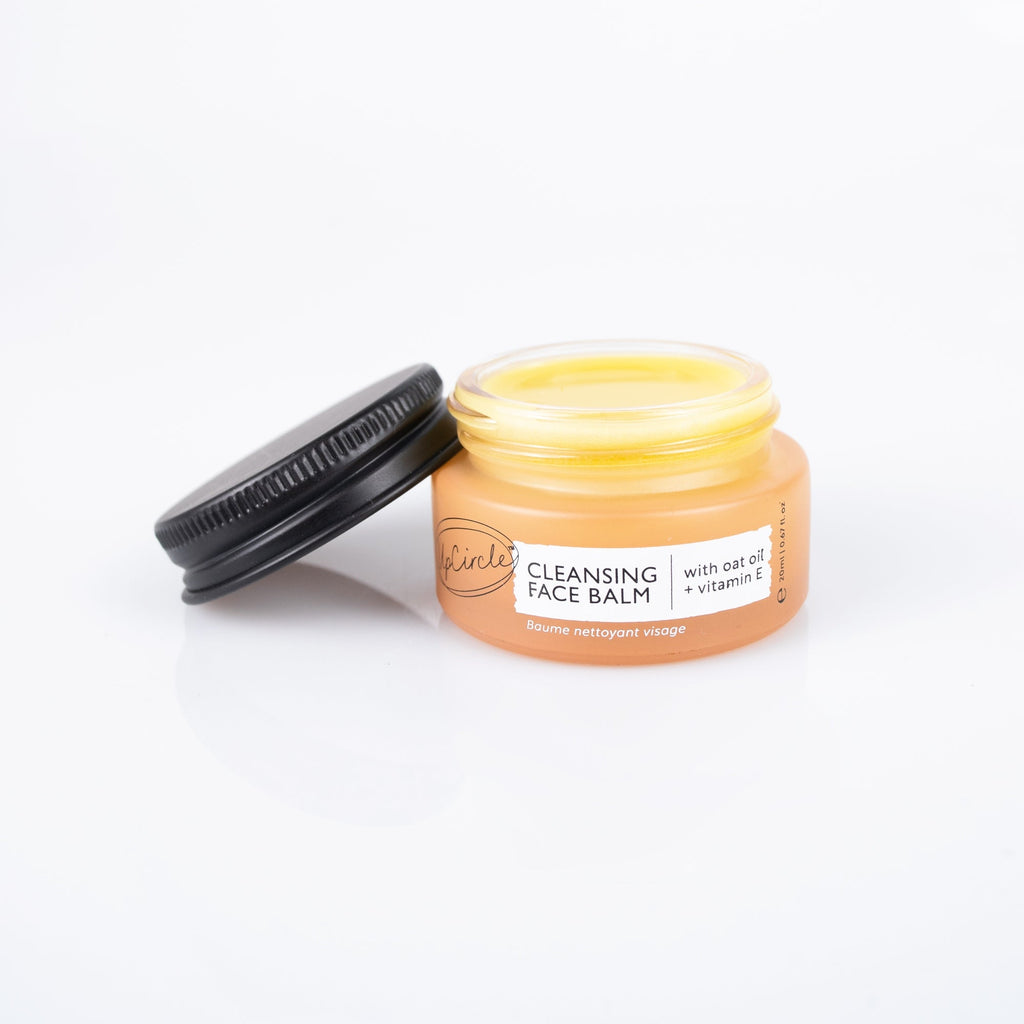 Jar of cleansing face balm with a black lid on a white background